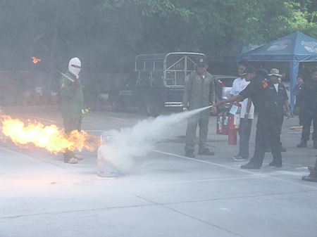 Employees of Grand Sole Hotel Pattaya Beach learn how to use a fire extinguisher.